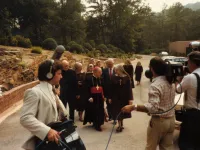 Mother Angelica, center, is followed by a taping crew outside EWTN headquarters in Irondale, Alabama.